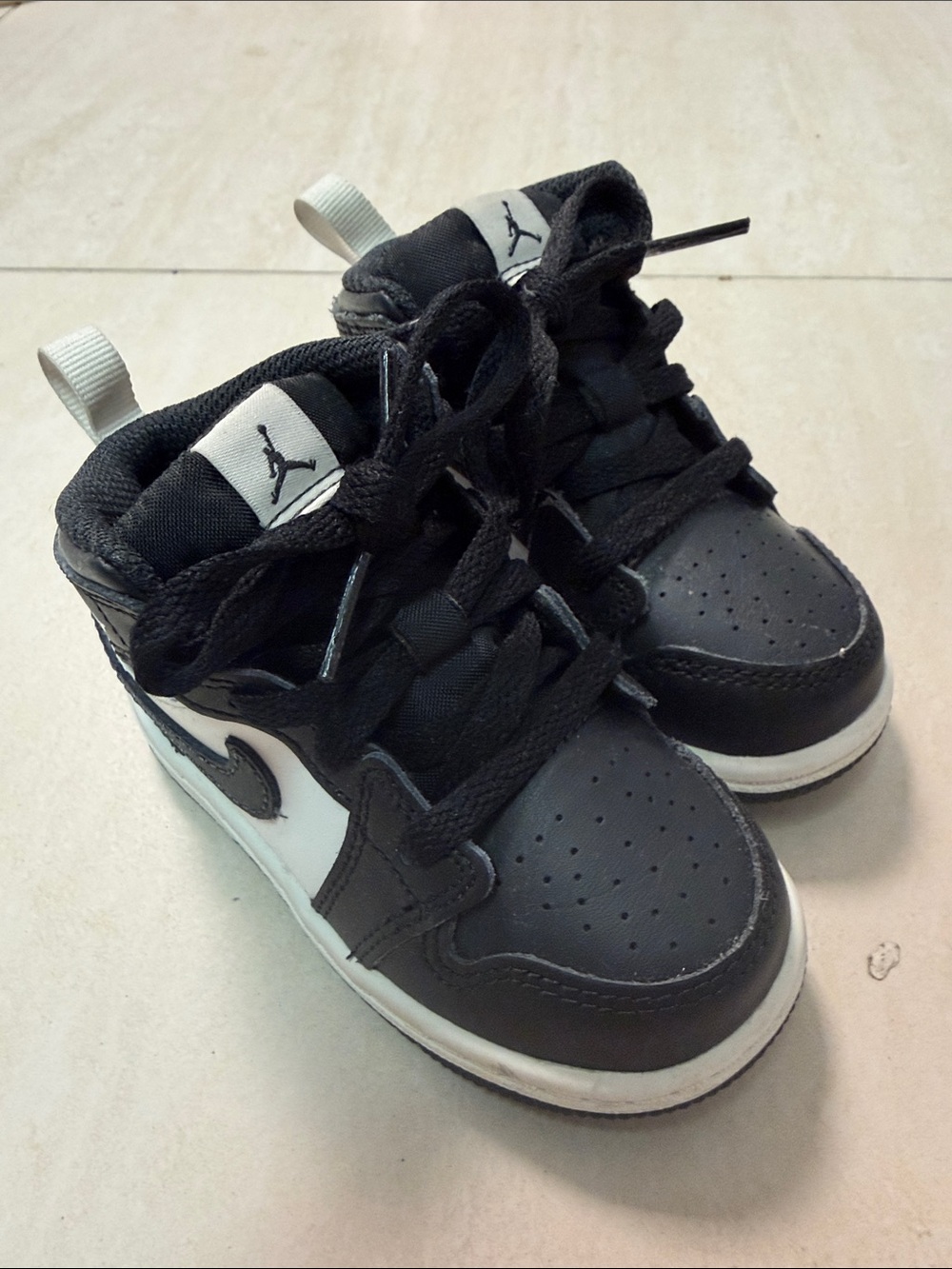 Jordan Kids Black and White High-Top Sneakers